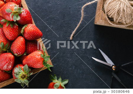 Top view of a wooden box with ripe fresh 30380646