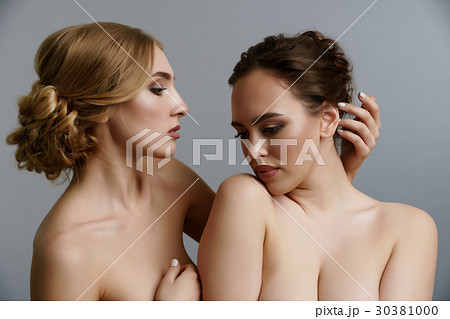 Two pretty girls posing naked in studio 30381000