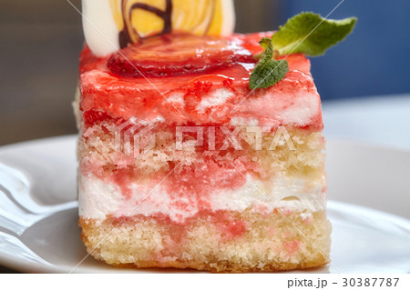 Strawberry cake covered with pink jam 30387787