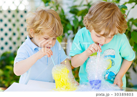 Two happy kids boys making experiment with 30389803