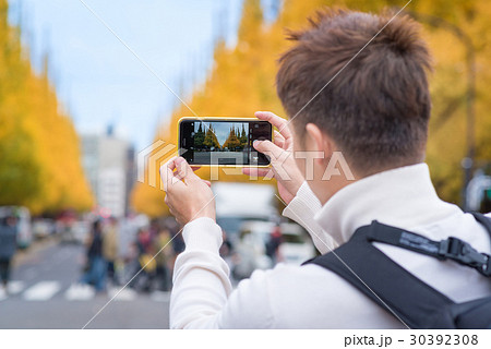 AsianTourists take a photo at Meiji Jingu Gaien 30392308
