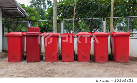 Red bins used to separate the hazardous waste. 30393803