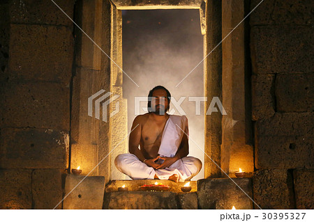 Priest or Yogi are sitting meditating in Ancient 30395327