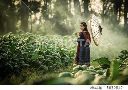 Laos women holding umbrella walking Laos women holding umbrella walking 30396194