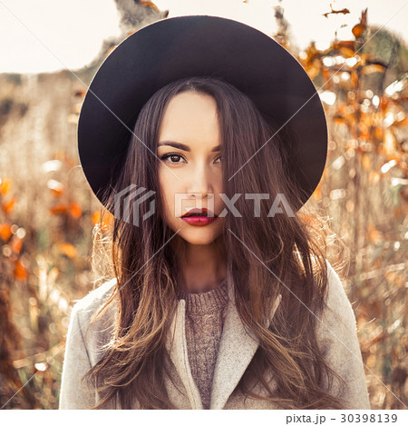 Fashion beautiful lady in autumn landscape 30398139