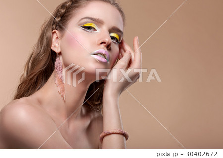 Portrait of a young woman with creative make-up  30402672
