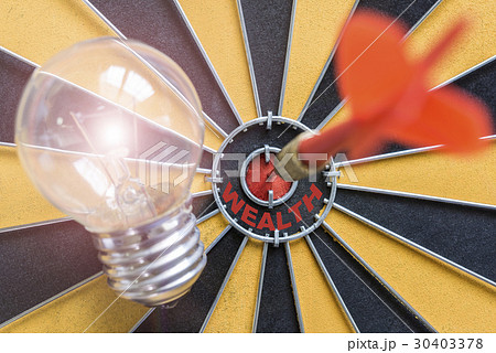 Arrow hitting bullseye target with idea lamp Arrow hitting bullseye target with idea lamp 30403378