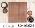 two wooden bowls with empty go game board 30403624