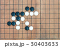 basic joseki in conner on go game board 30403633