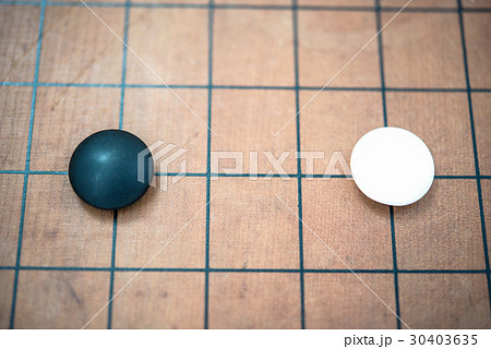white stone approach to black stone on go game board white stone approach to black stone on go game board 30403635