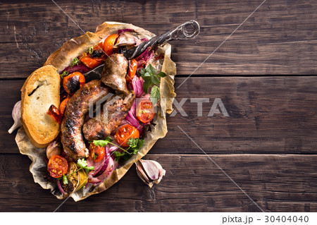 Rustic homemade sausages with onion and tomatoes 30404040