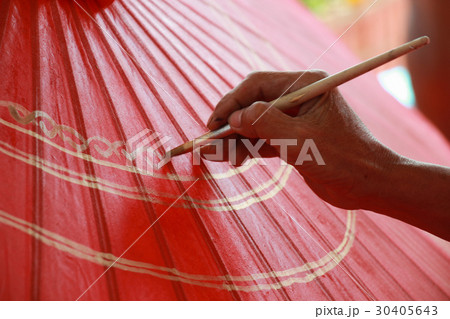 man painting color on umbrella man painting color on umbrella 30405643