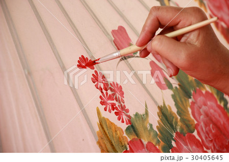 man painting color on umbrella man painting color on umbrella 30405645