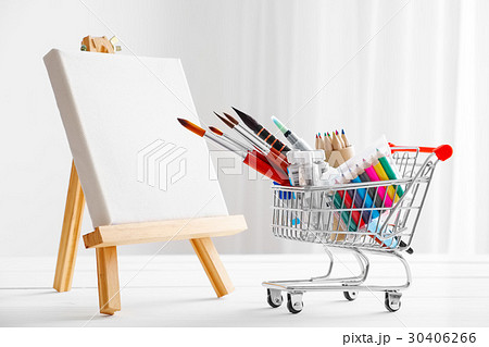 Mini shopping cart full with artistic goods Mini shopping cart full with artistic goods 30406266