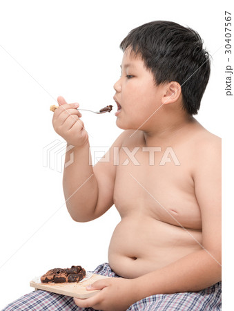 obese boy eat chocolate isolated on white 30407567