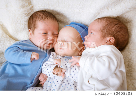 Portrait of newborn triplets - boys close up Portrait of newborn triplets - boys close up 30408203