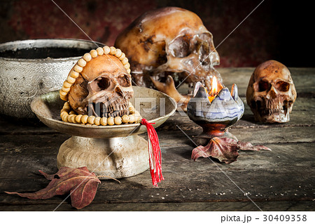 Skull rosary on the old wooden floor. 30409358