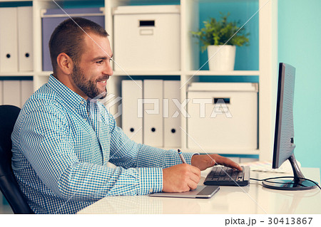 Graphic designer at work, toned 30413867