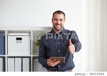 Happy businessman with digital tablet Happy businessman with digital tablet 30415069