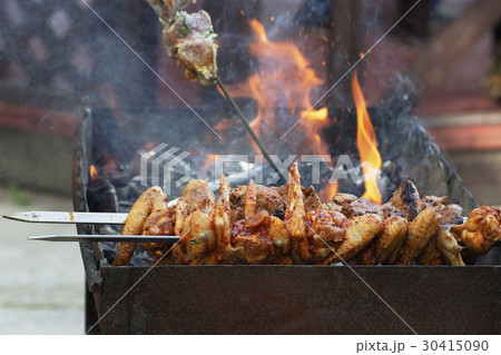 Cooking shish kebab,   chicken wings 30415090