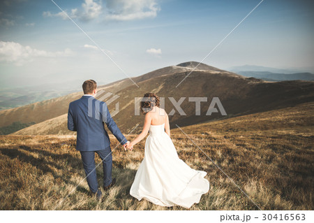 Happy beautiful wedding couple bride and groom at Happy beautiful wedding couple bride and groom at 30416563