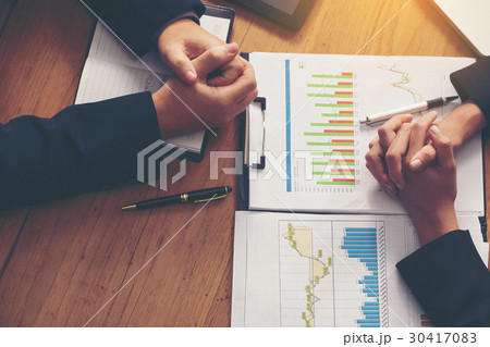 Hand, two men on a desk. Negotiating business. Hand, two men on a desk. Negotiating business. 30417083