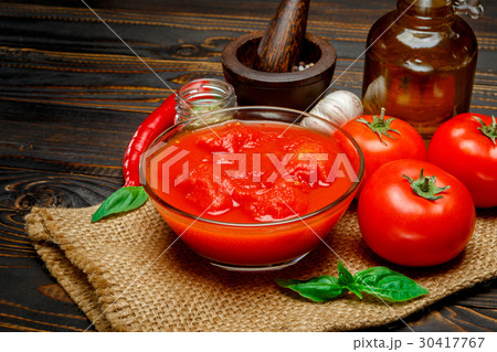 tomato sauce or puree on wooden table tomato sauce or puree on wooden table 30417767