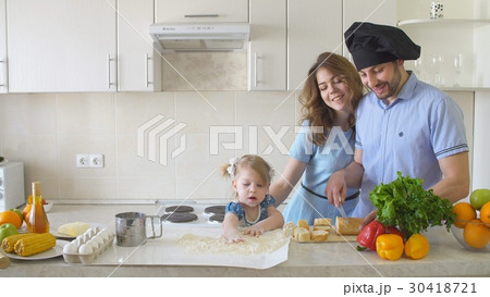 Happy Family is Cooking in The Kitchen. Happy Family is Cooking in The Kitchen. 30418721