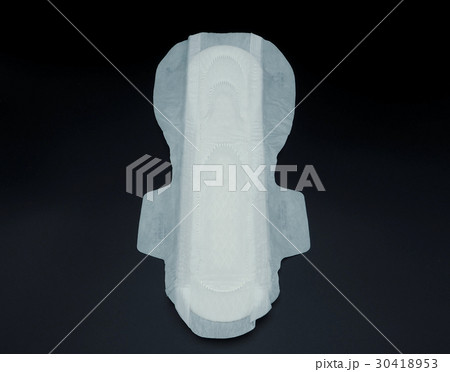 Sanitary napkin white color on black background. 30418953
