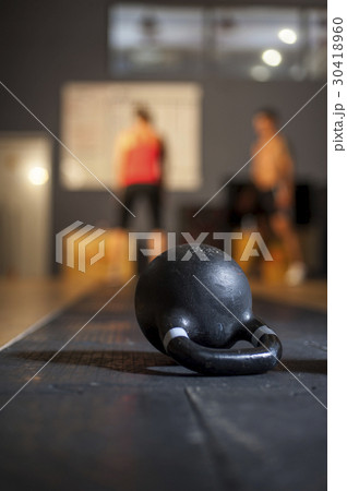 Kettlebell lying on the floor in gym 30418960