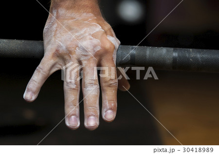 Closeup of male hand holding barbell Closeup of male hand holding barbell 30418989