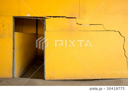 Old cracked yellow concrete wall 30419775