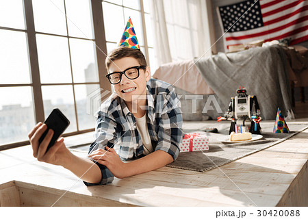 Happy boy making selfie photo Happy boy making selfie photo 30420088