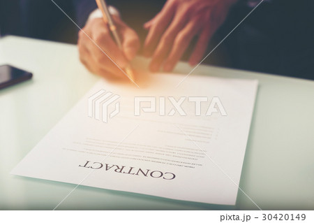 Business man signing a contract Business man signing a contract 30420149