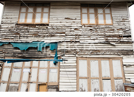 Weathered old house and windows with peeling paint 30420205