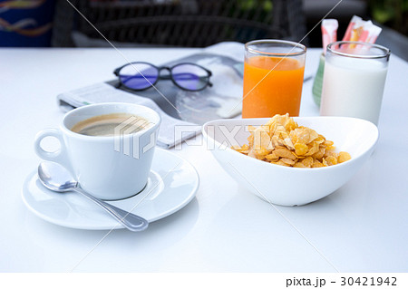 Breakfast set with cornflakes and cup of coffee  30421942