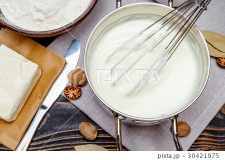 bechamel sauce in a pan and ingredients 30421975