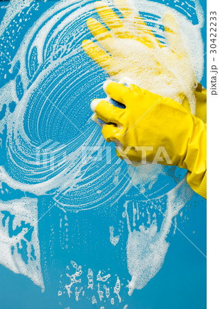 Man in gloves washes glass 30422233