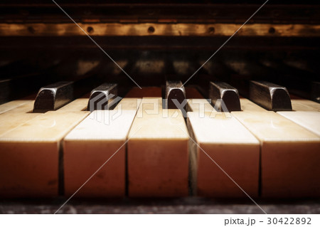 Closeup of antique piano keys 30422892