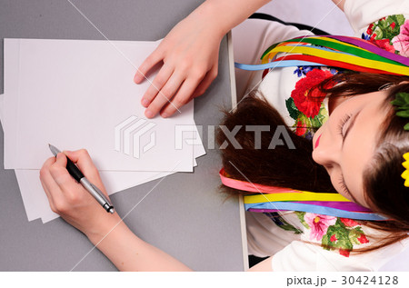 Happy businesswoman with note and pen Happy businesswoman with note and pen 30424128