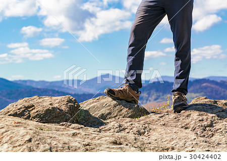 Man at the edge of a cliff 30424402