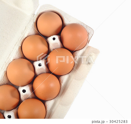 Carton of fresh brown eggs on a white Carton of fresh brown eggs on a white 30425283
