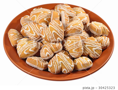 Cookies in heart shape on a ceramic plate on white Cookies in heart shape on a ceramic plate on white 30425323