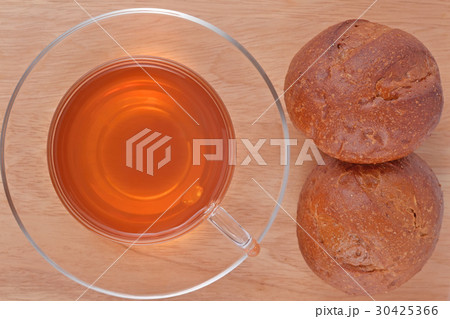 Cup of tea and two fresh buns Cup of tea and two fresh buns 30425366