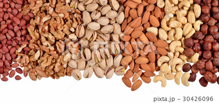 Heap of assorted nuts on a white 30426096