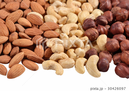 Heap of assorted nuts on a white 30426097