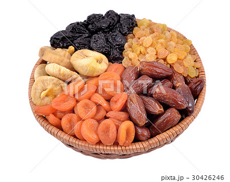 Various dried fruits in wicker bowl 30426246