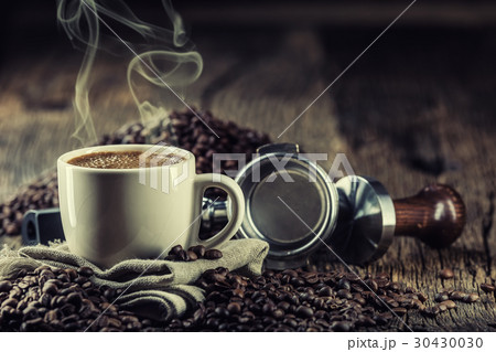 Coffee.Cup of black coffe with coffee beans tamper Coffee.Cup of black coffe with coffee beans tamper 30430030