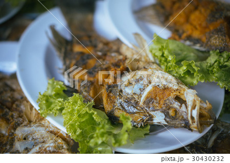 Fried fish on plate , selective focus Fried fish on plate , selective focus 30430232