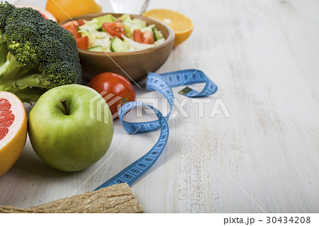 Food for diet  on a wooden table. 30434208